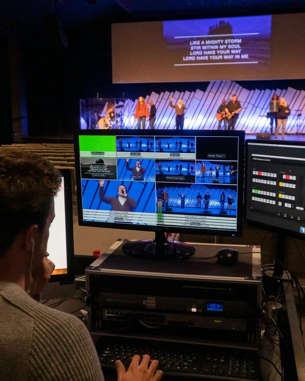 An operator cutting footage at a broadcast edit bay